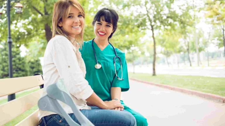 a woman sitting together with her nurse