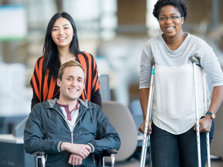a couple of people posing and smiling for the camera